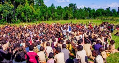 Hundreds of schoolchildren gathered in a field in Ntchisi, Malawi to hear the Gospel